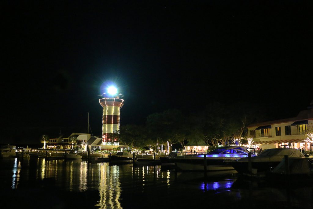 Lighthouse decorated in lights for Christmas.